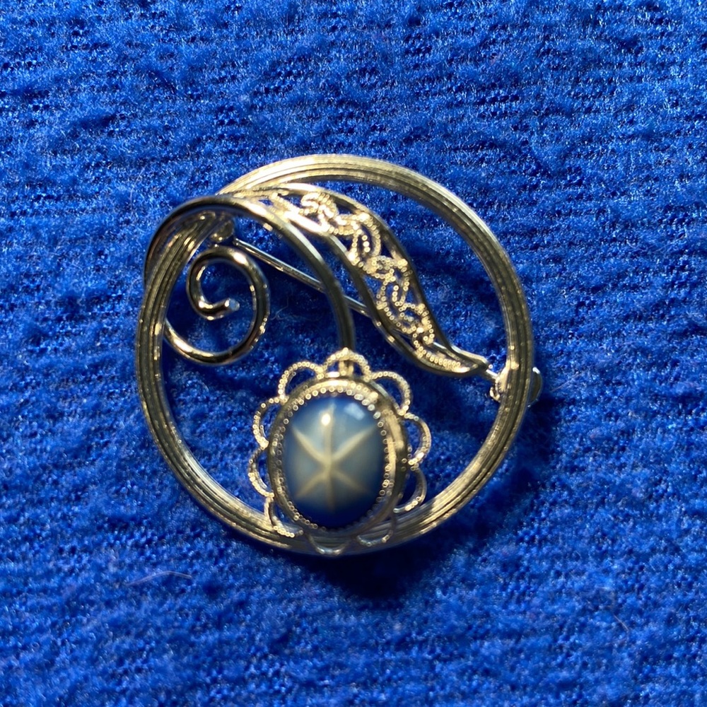 Vintage silver tone brooch with faux blue star sapphire